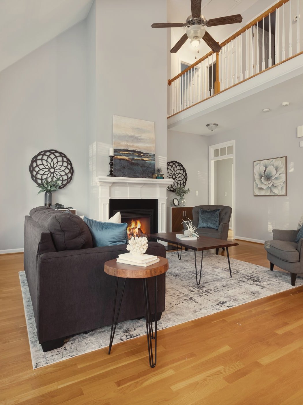 A townhouse living room with the fire lit